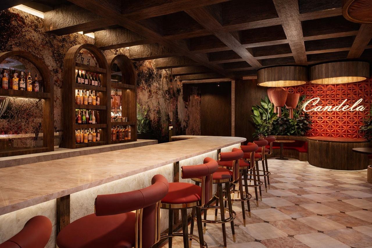 The Candela bar — marble counter, mahogany stools and the neon Candela sign