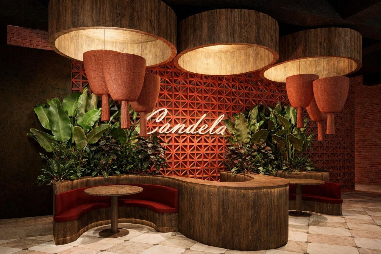 The Candela signature wall — terracotta lattice, woven pendants and curved banquette